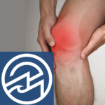 Man's hands holding knee with red color emphasizing pain and swelling